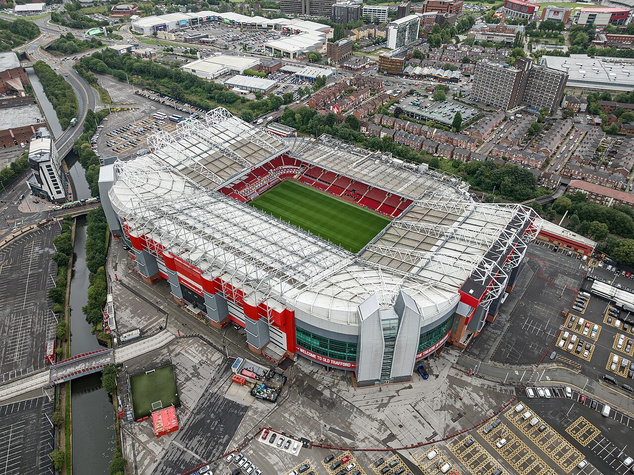 Aerial view of Old Trafford stadium and the surrounding Manchester neighbourhood, photographed in July 2023.