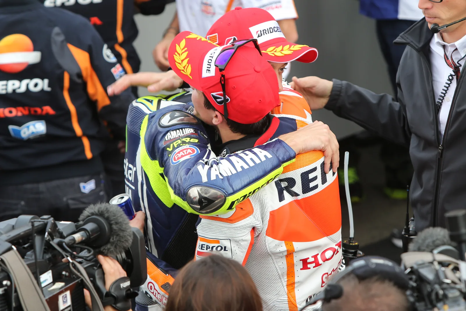 Valentino Rossi and Marc Márquez congratulate each other after the 2014 Valencia Grand Prix.